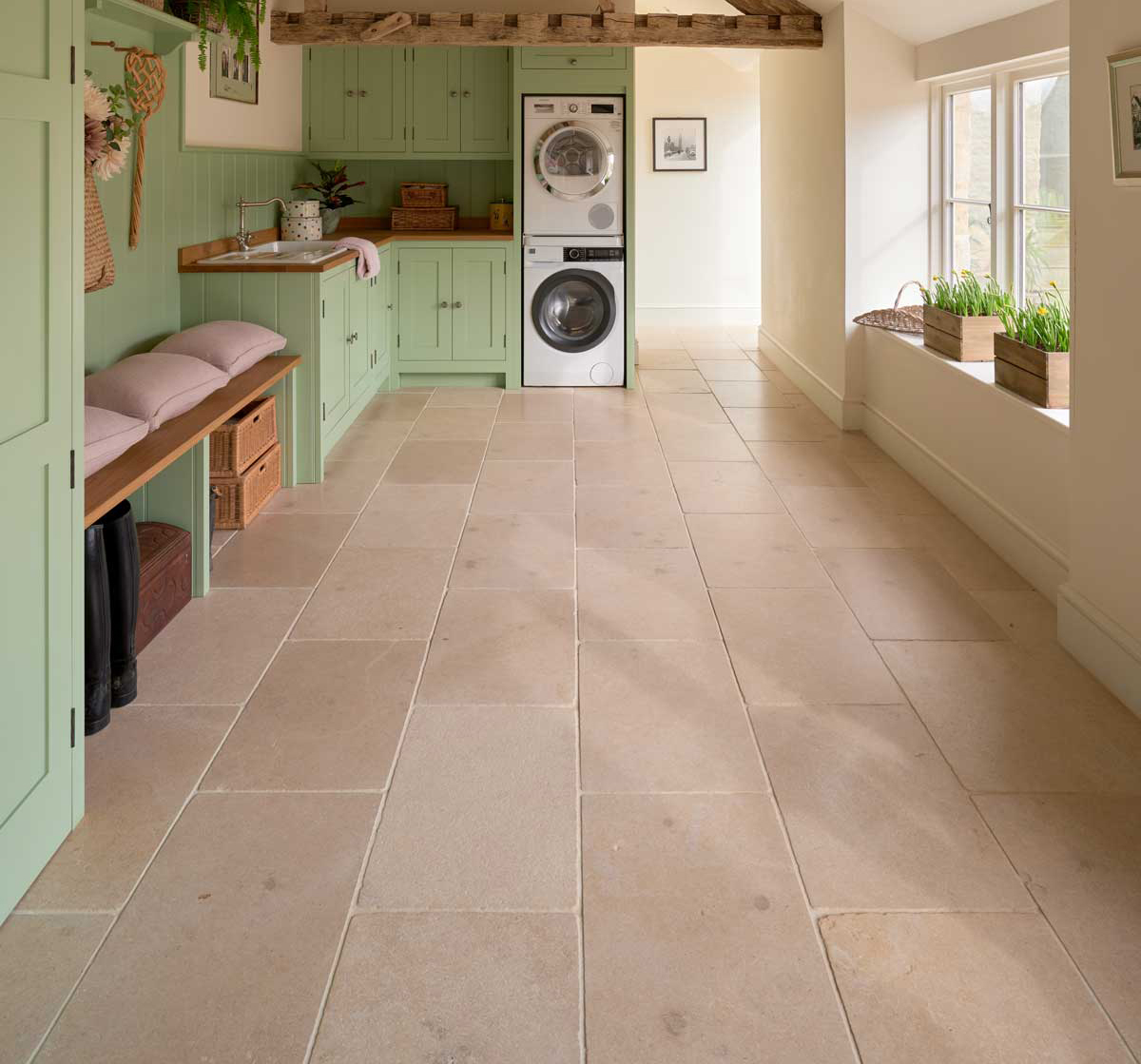 Buscot Limestone Tumbled tiles also feature in the utility room Buscot Limestone Tumbled tiles also feature in the utility room