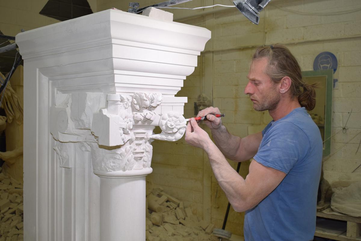 ‘Bart’, who works in the Meister Masonry banker shop, carves the jambs for the new fireplace. ‘Bart’, who works in the Meister Masonry banker shop, carves the jambs for the new fireplace.