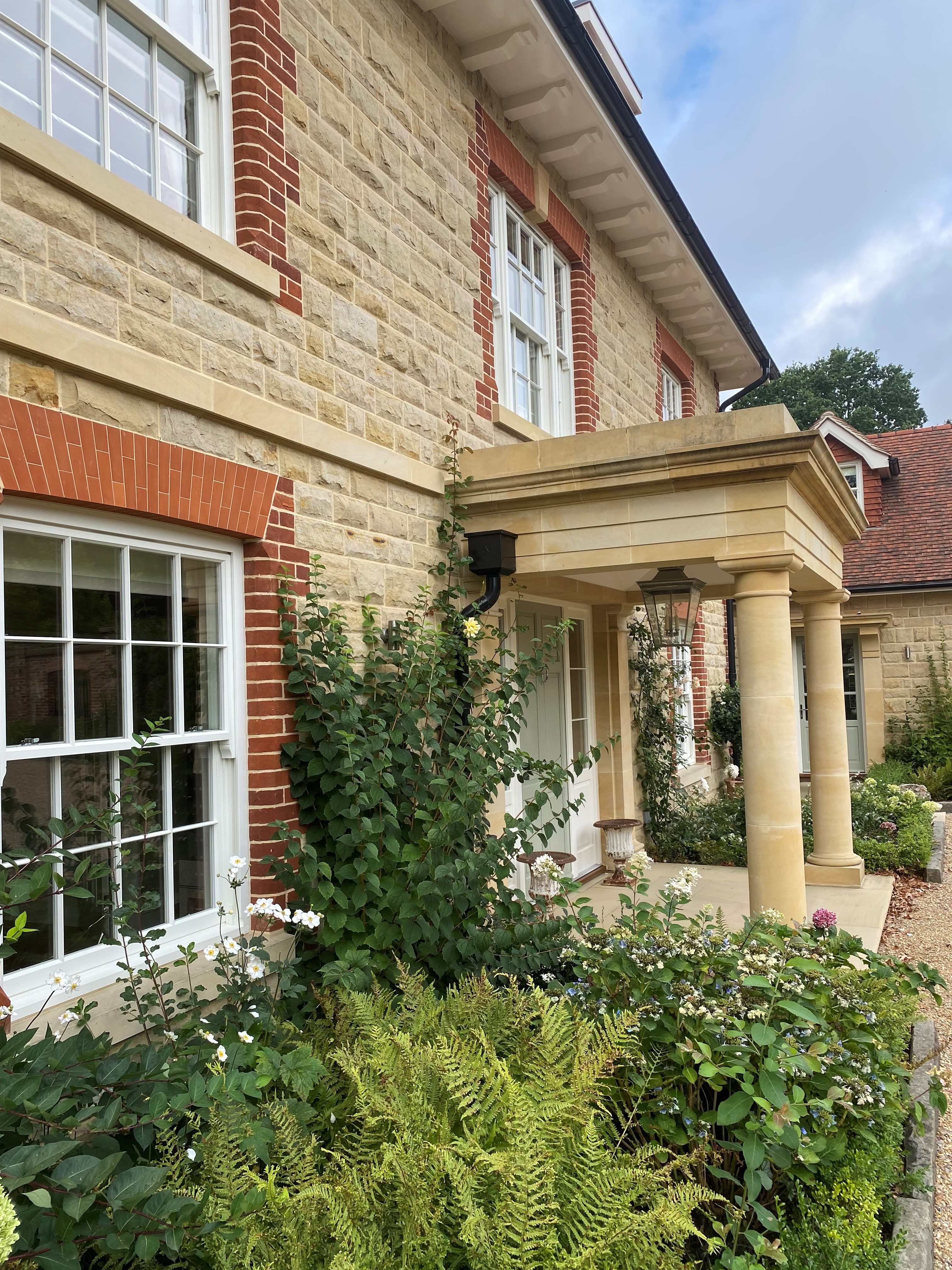 Private Residence - Near East Grinstead – Wealden Sussex Sandstone Coursed Split Face Walling & Fine Grade Masonry - Portico, Doorway Surround, Cills, String Course & Keystones