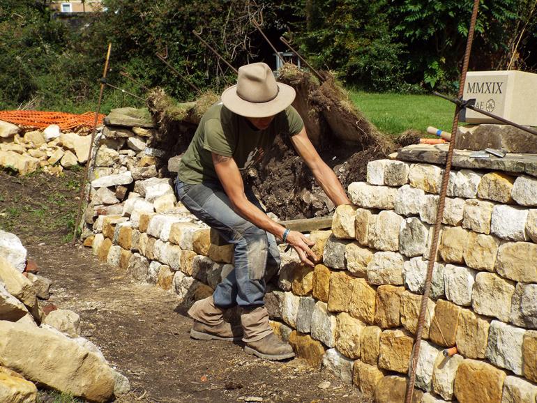 Emma Knowles building a dry stone wall