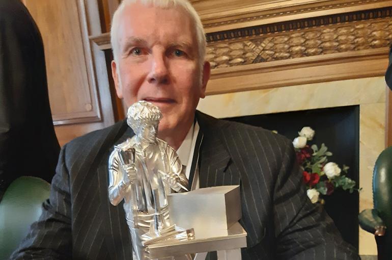 Master Martin Low with the statuette he donated