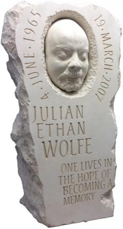 A death mask incorporated into this Portland limestone memorial by Joss Nankoo. A death mask incorporated into this Portland limestone memorial by Joss Nankoo.