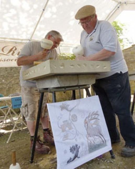 John Swift, Chairman of the West Riding Stonecarving Association, and Member Garth Baldwin work on the panel marking the opening of the new car park. John Swift, Chairman of the West Riding Stonecarving Association, and Member Garth Baldwin work on the panel marking the opening of the new car park.