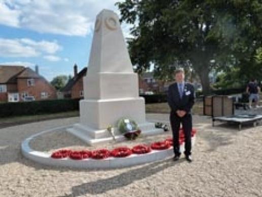 Award-winning mason Chris Berridge with the new War Memorial at Woodley. Award-winning mason Chris Berridge with the new War Memorial at Woodley.